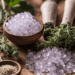 crystals and herbs on a wooden table.